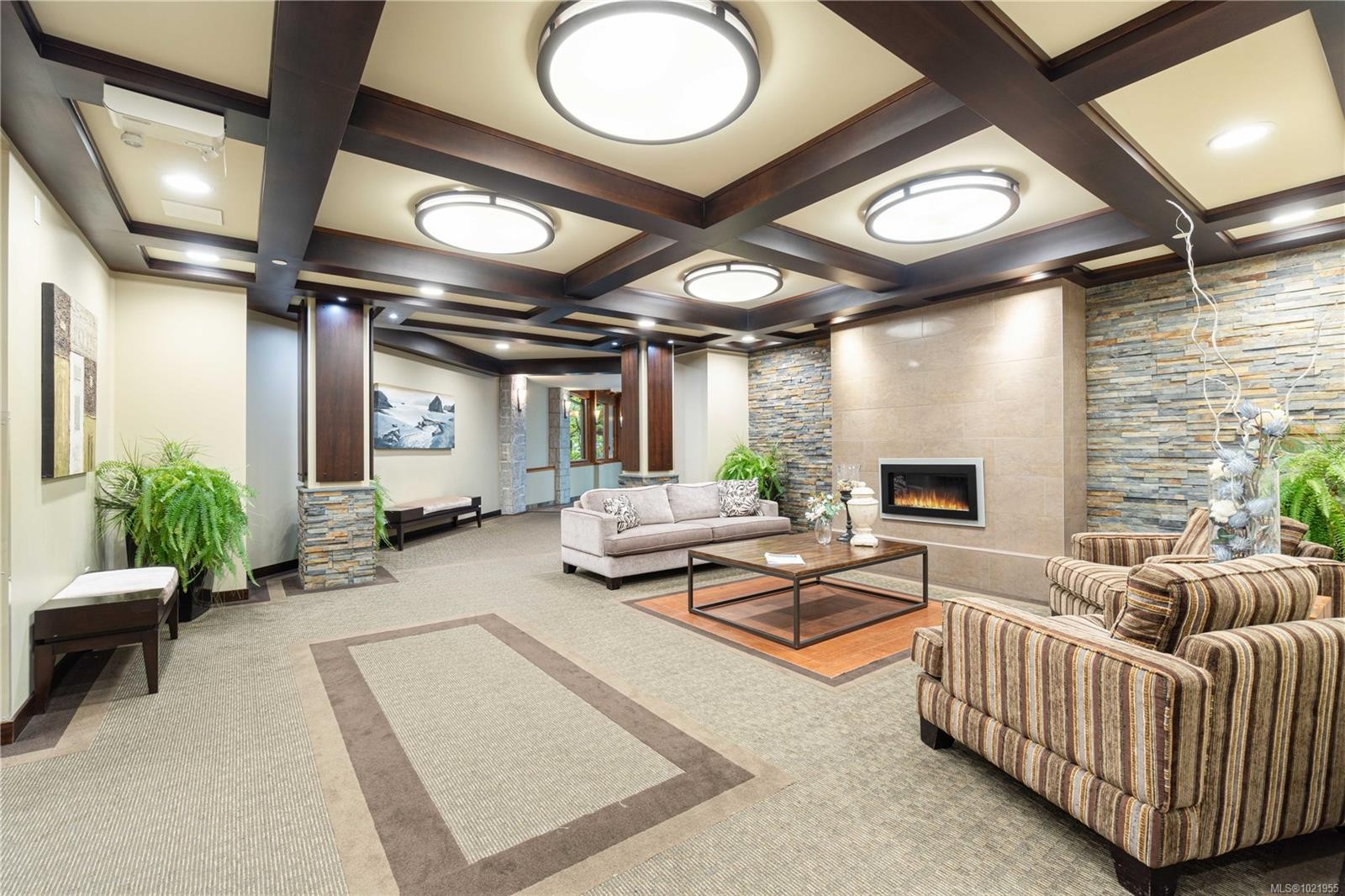 202-5670 Edgewater Lane, Nanaimo, BC - Indoor Photo Showing Other Room With Fireplace