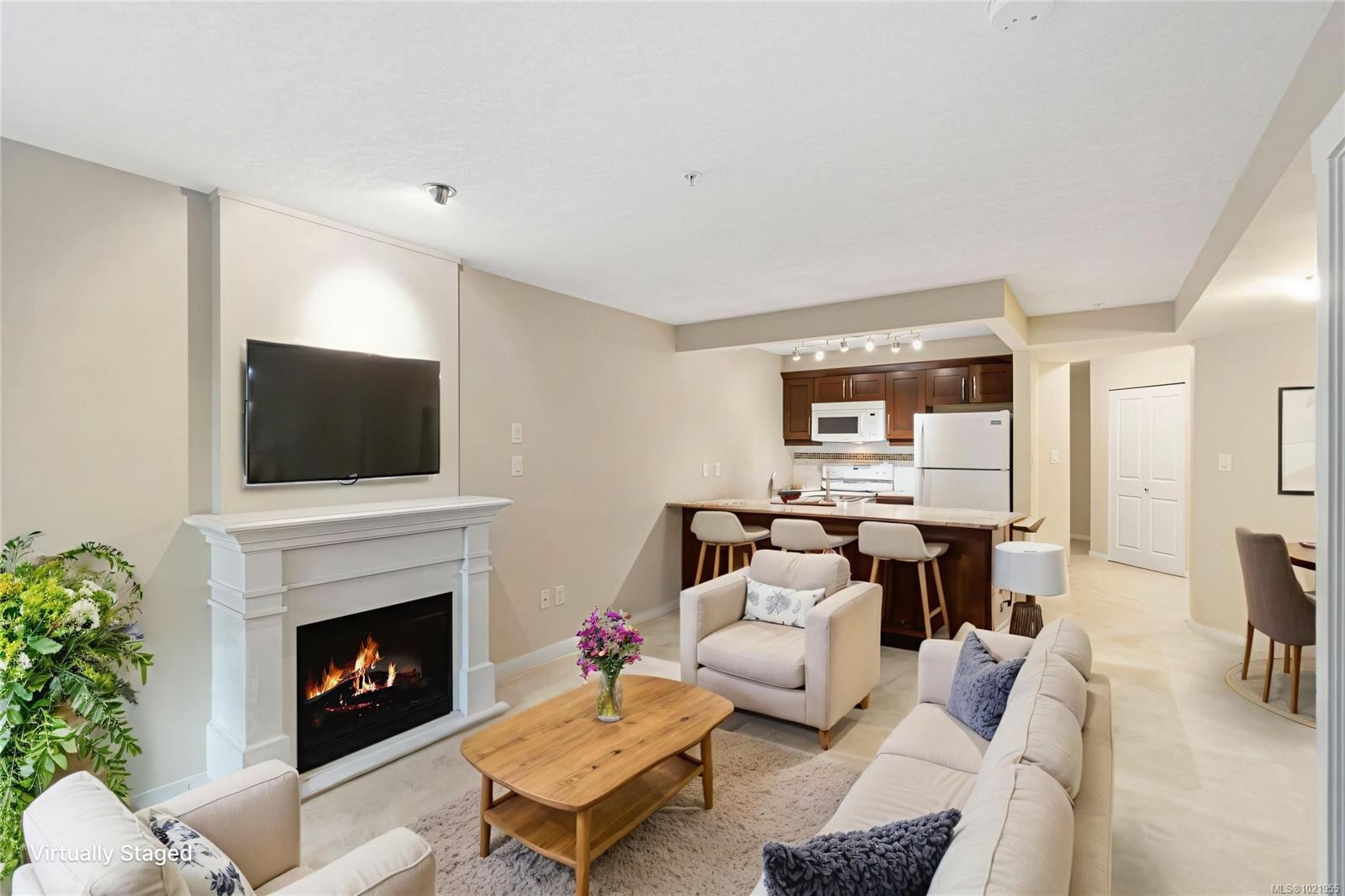 202-5670 Edgewater Lane, Nanaimo, BC - Indoor Photo Showing Living Room With Fireplace