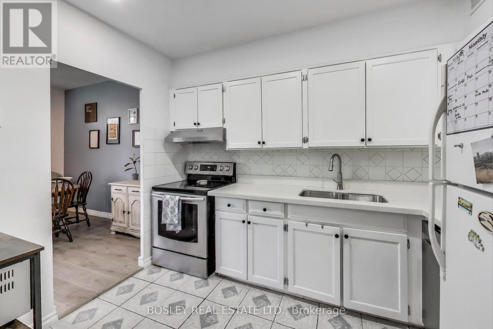111 - 10 Parkway Forest Drive, Toronto, ON - Indoor Photo Showing Kitchen With Double Sink