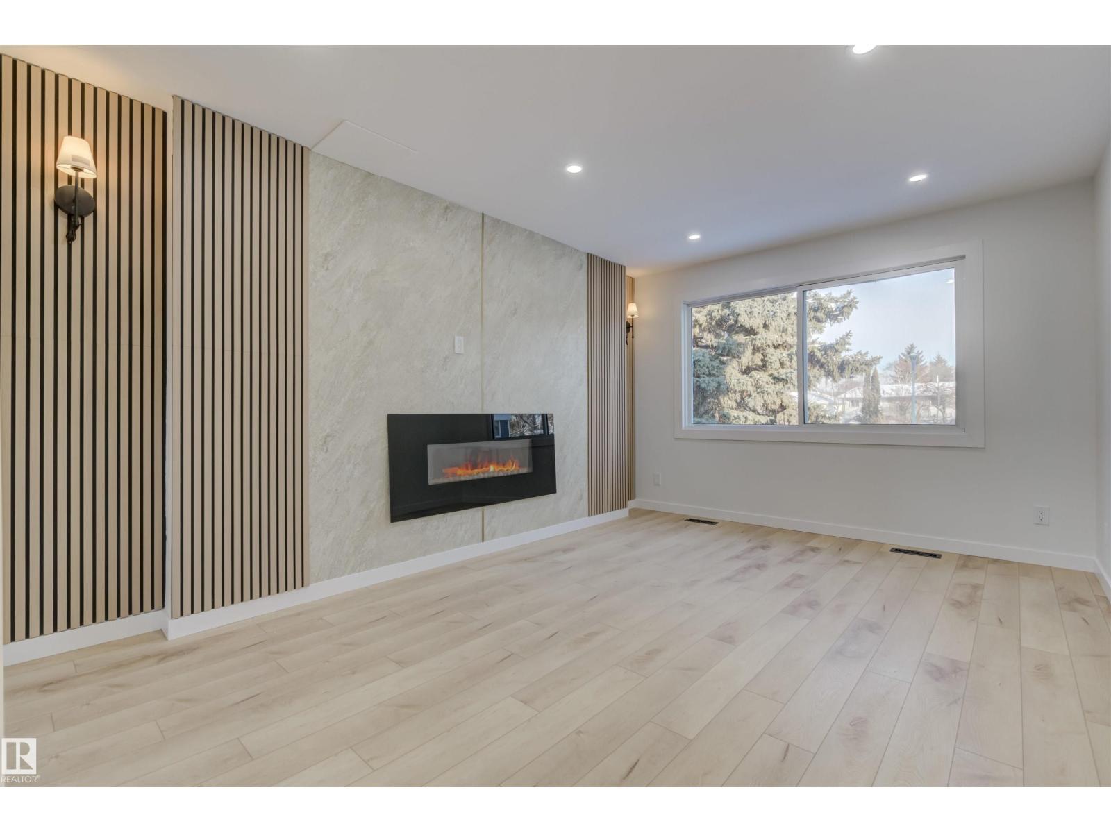 123 Morin Maze Mz Nw, Edmonton, AB - Indoor Photo Showing Living Room With Fireplace