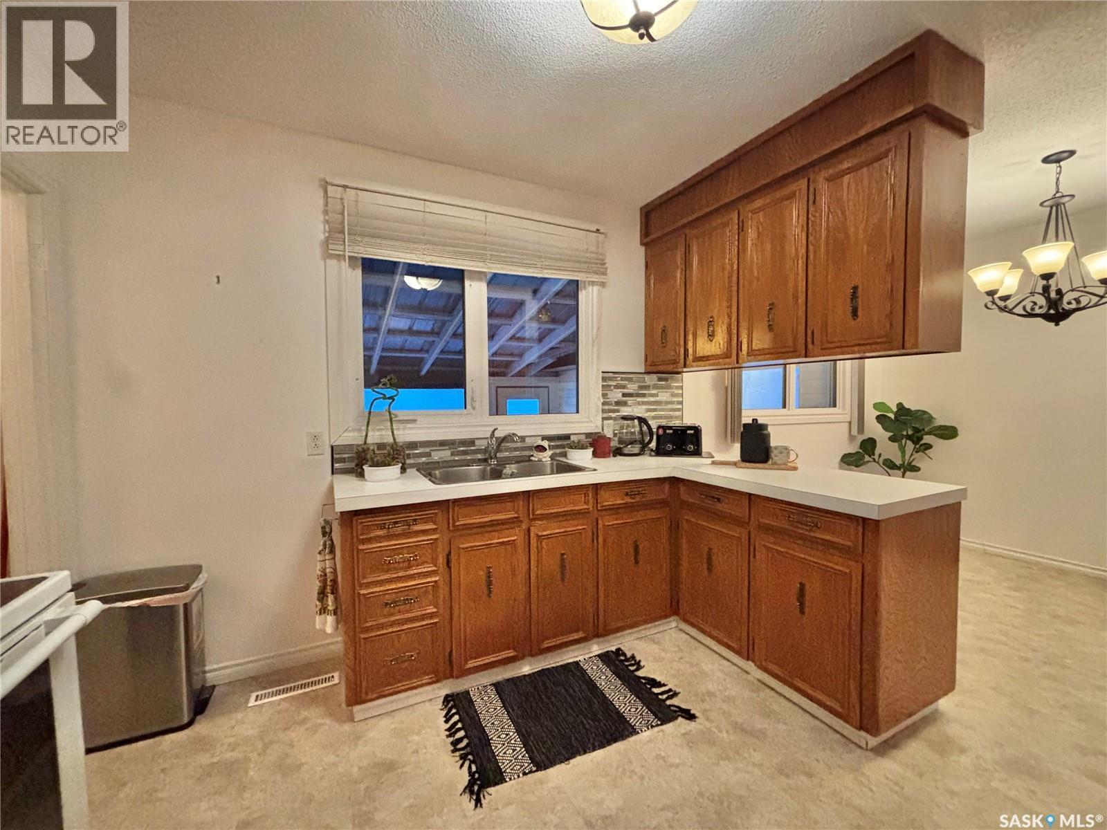 53 Bailey Drive, Yorkton, SK - Indoor Photo Showing Kitchen With Double Sink