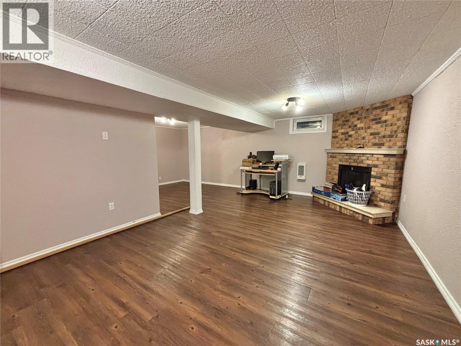 53 Bailey Drive, Yorkton, SK - Indoor Photo Showing Other Room With Fireplace