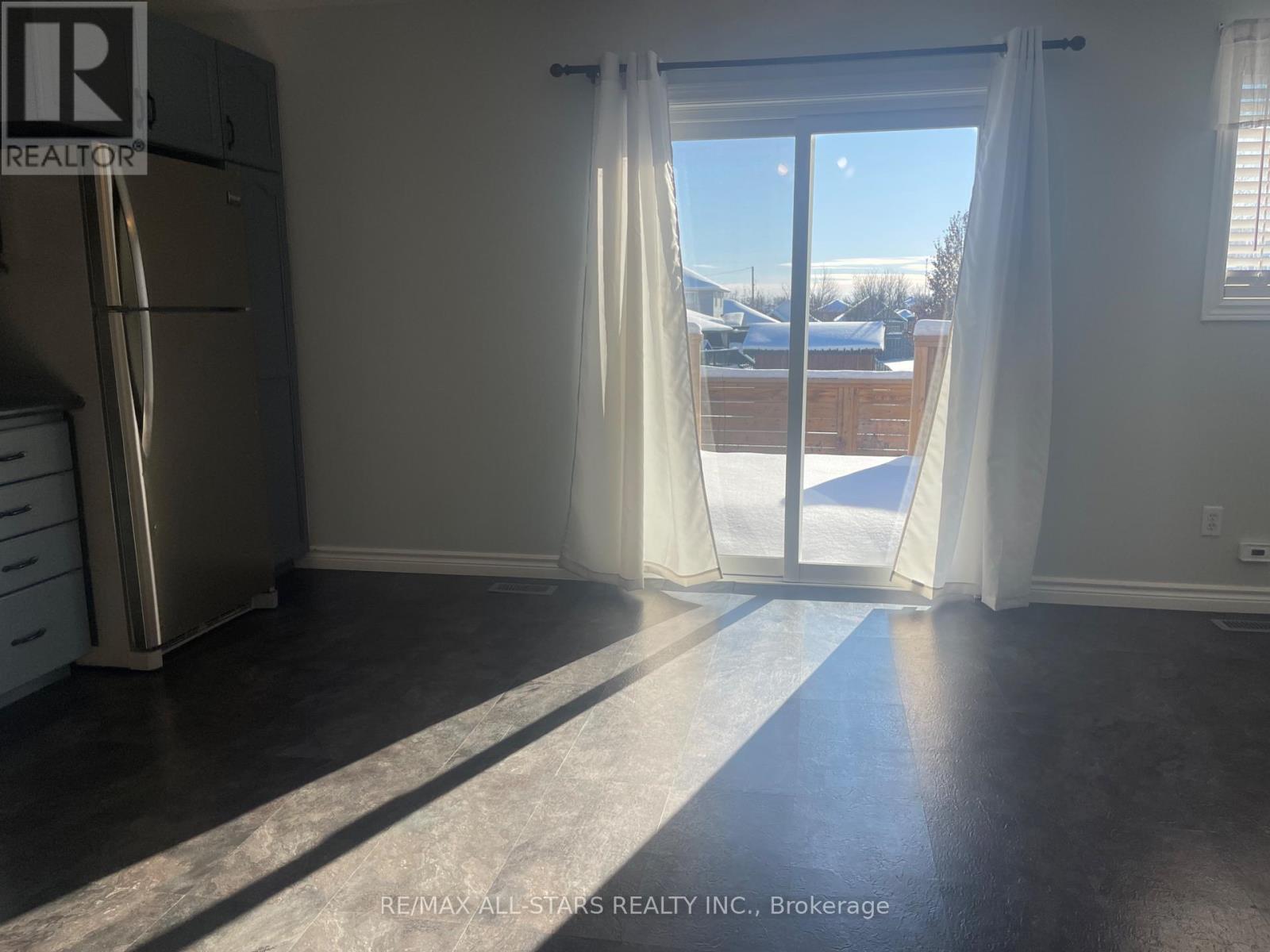 Walk out to deck/ rear yard (south facing) - Main Floor - 39 Mcgibbon Boulevard, Kawartha Lakes (Lindsay), ON - Indoor Photo Showing Other Room