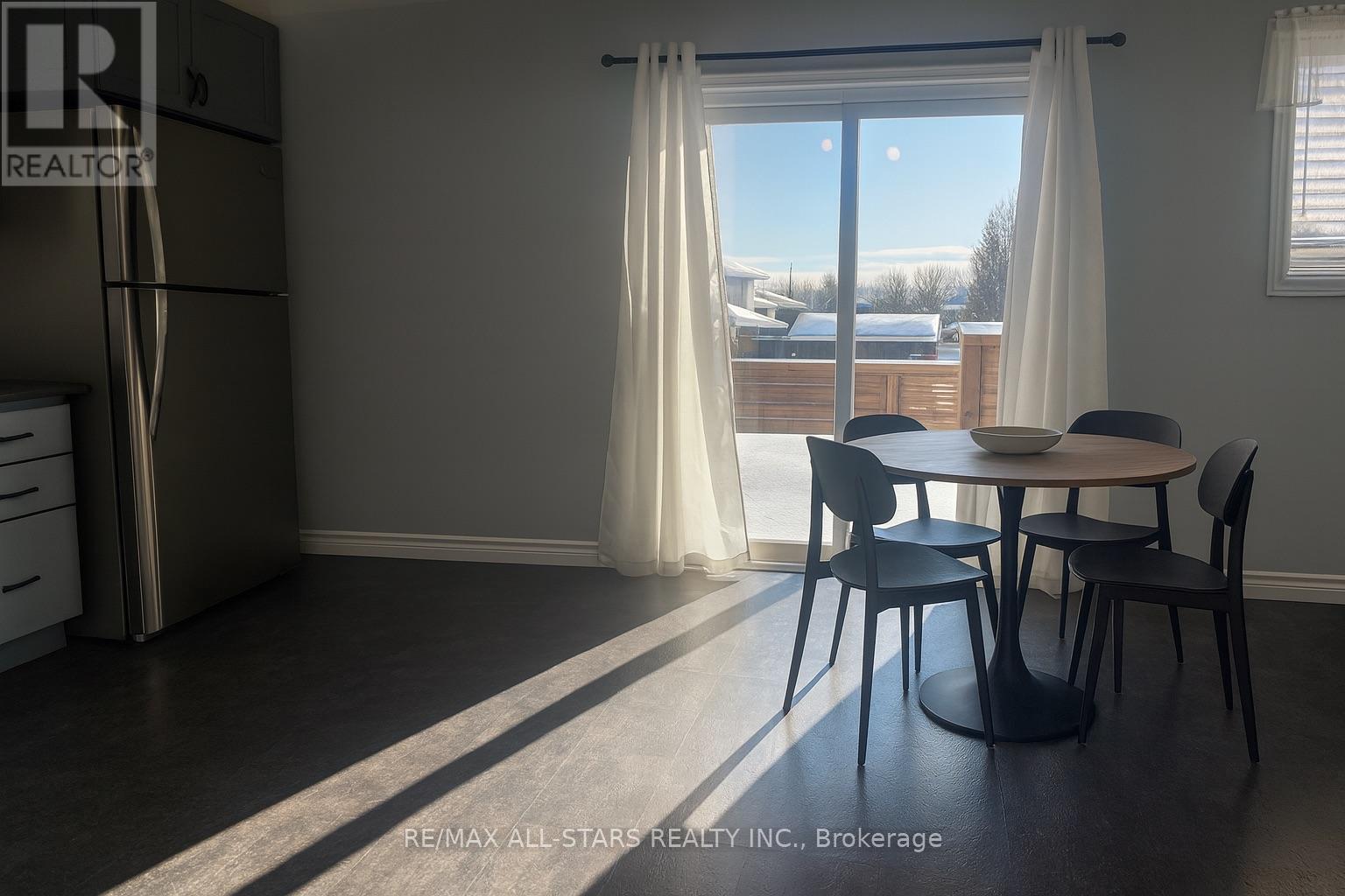 Staged pic of kitchen with walk out to deck - Main Floor - 39 Mcgibbon Boulevard, Kawartha Lakes (Lindsay), ON - Indoor Photo Showing Dining Room