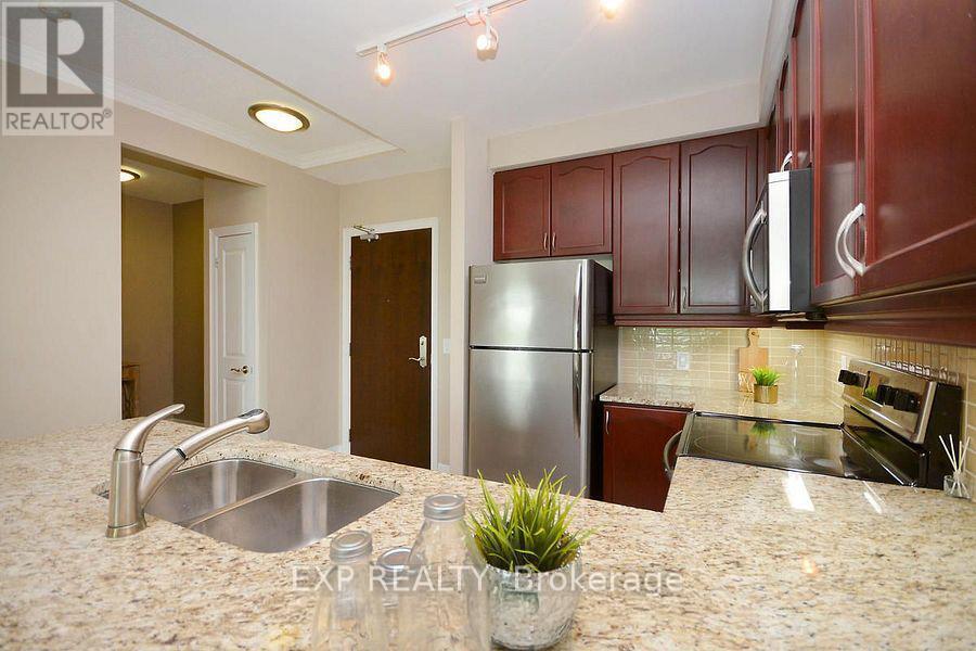 1007 - 100 John Street, Brampton, ON - Indoor Photo Showing Kitchen With Stainless Steel Kitchen With Double Sink