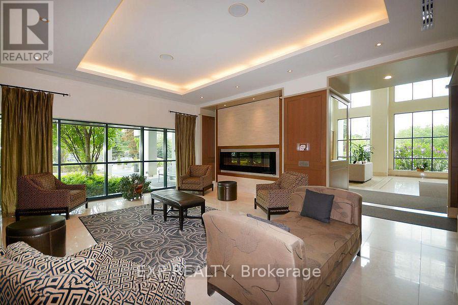 1007 - 100 John Street, Brampton, ON - Indoor Photo Showing Other Room With Fireplace