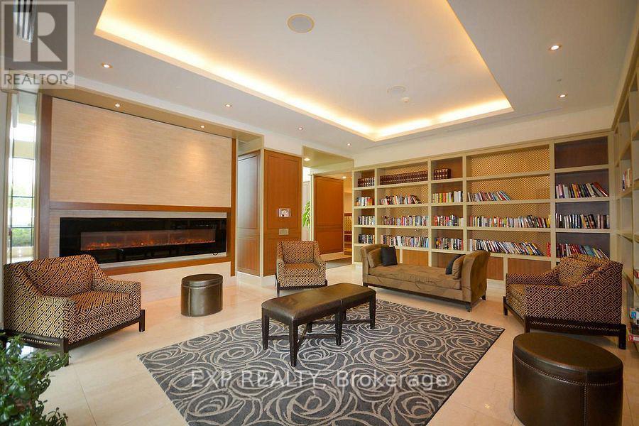 1007 - 100 John Street, Brampton, ON - Indoor With Fireplace