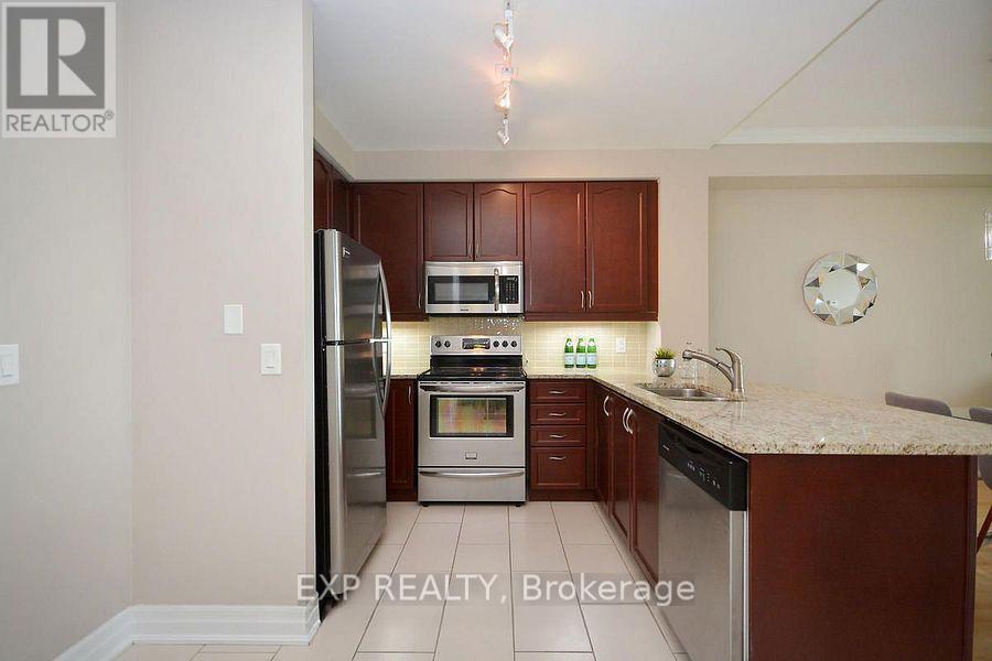 1007 - 100 John Street, Brampton, ON - Indoor Photo Showing Kitchen With Stainless Steel Kitchen With Double Sink