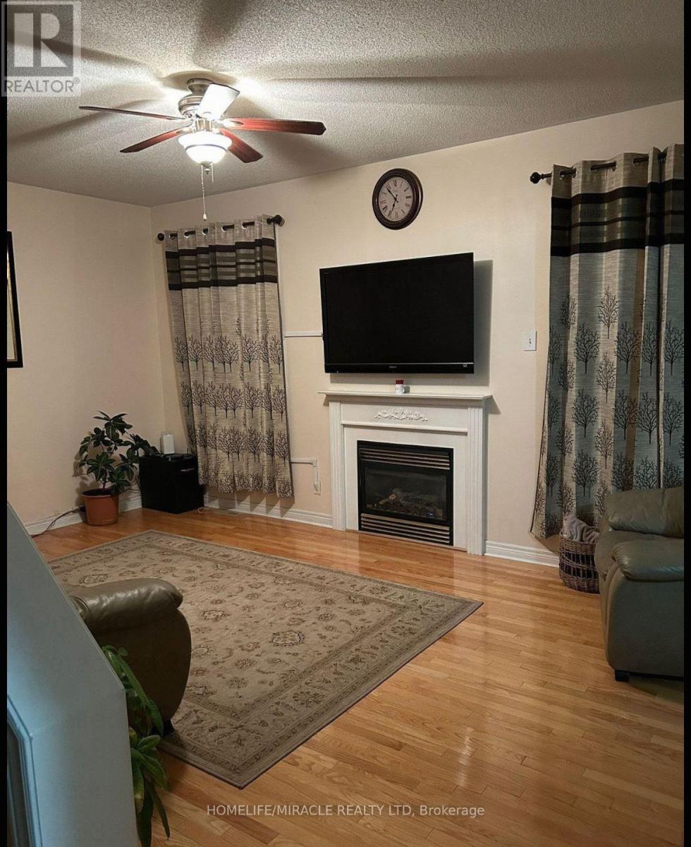 20 Midnightsun Trail, Brampton, ON - Indoor Photo Showing Living Room With Fireplace