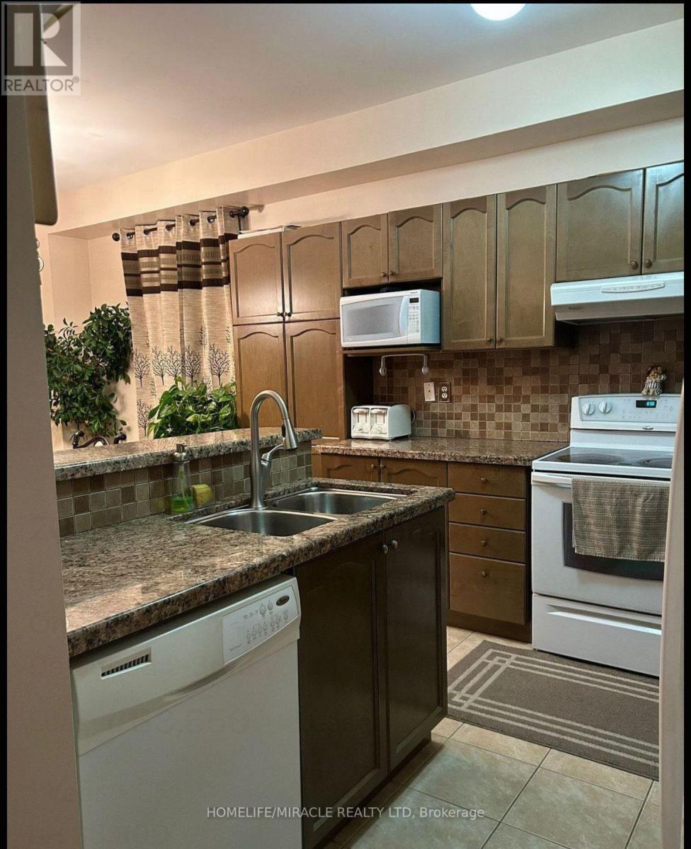 20 Midnightsun Trail, Brampton, ON - Indoor Photo Showing Kitchen With Double Sink