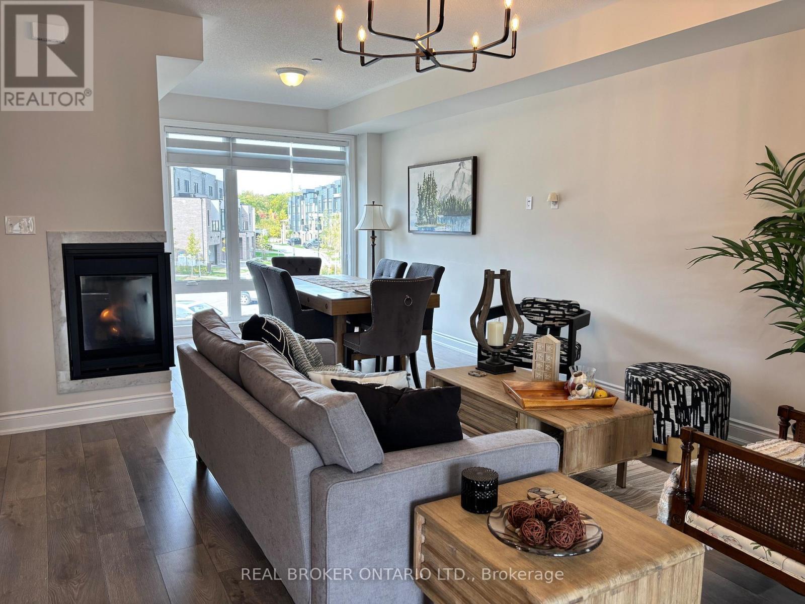 Living area - 113 Marina Village Drive, Georgian Bay, ON - Indoor Photo Showing Living Room With Fireplace