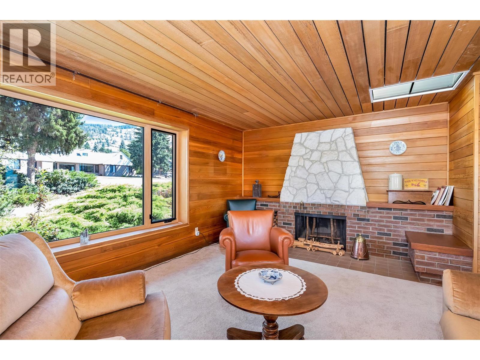 460 Crestview Drive, Coldstream, BC - Photo Showing Living Room With Fireplace