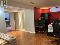 Office area featuring wood finished floors and baseboards -