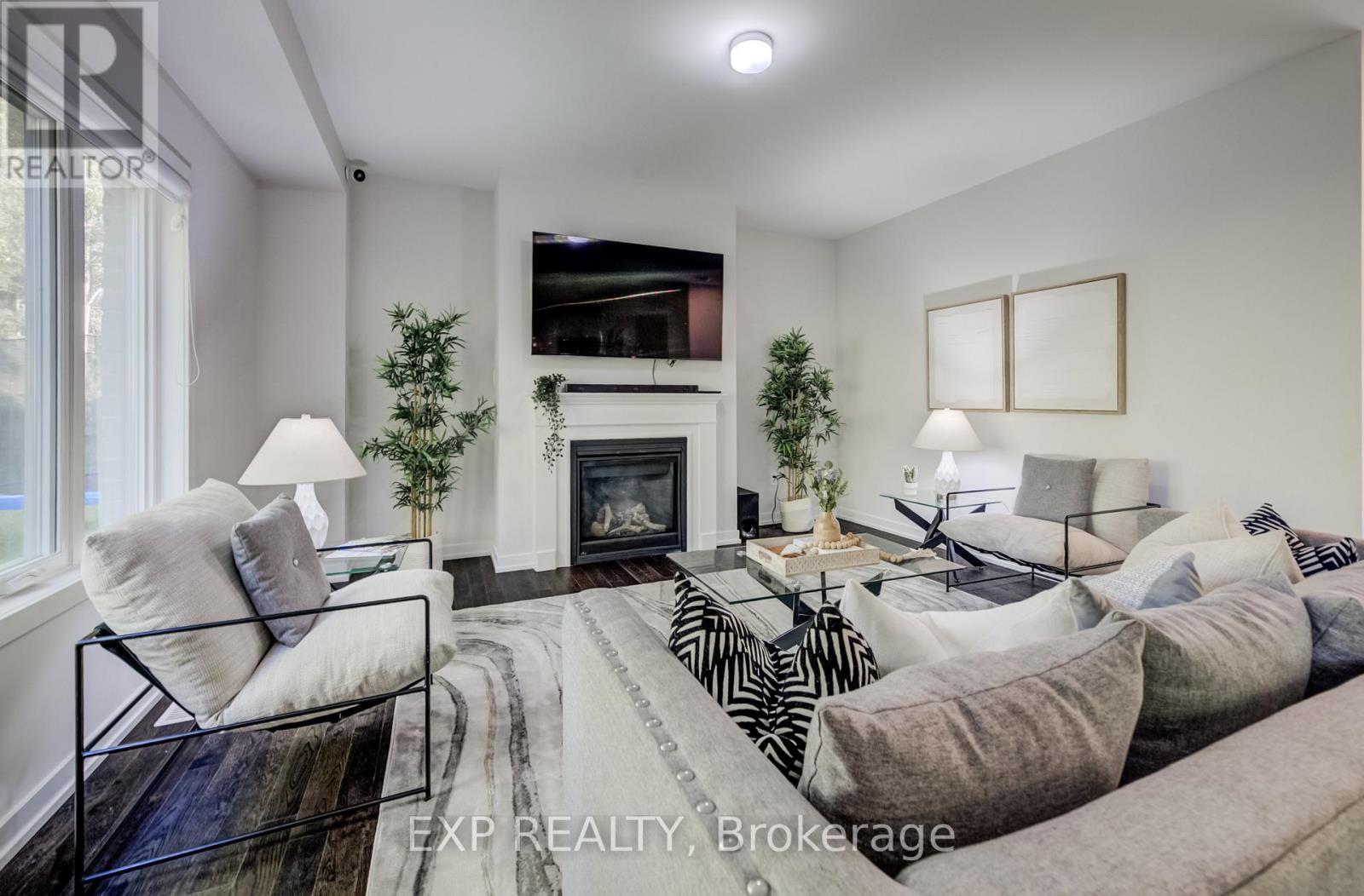 55 Tulip Crescent, Norfolk, ON - Indoor Photo Showing Living Room With Fireplace