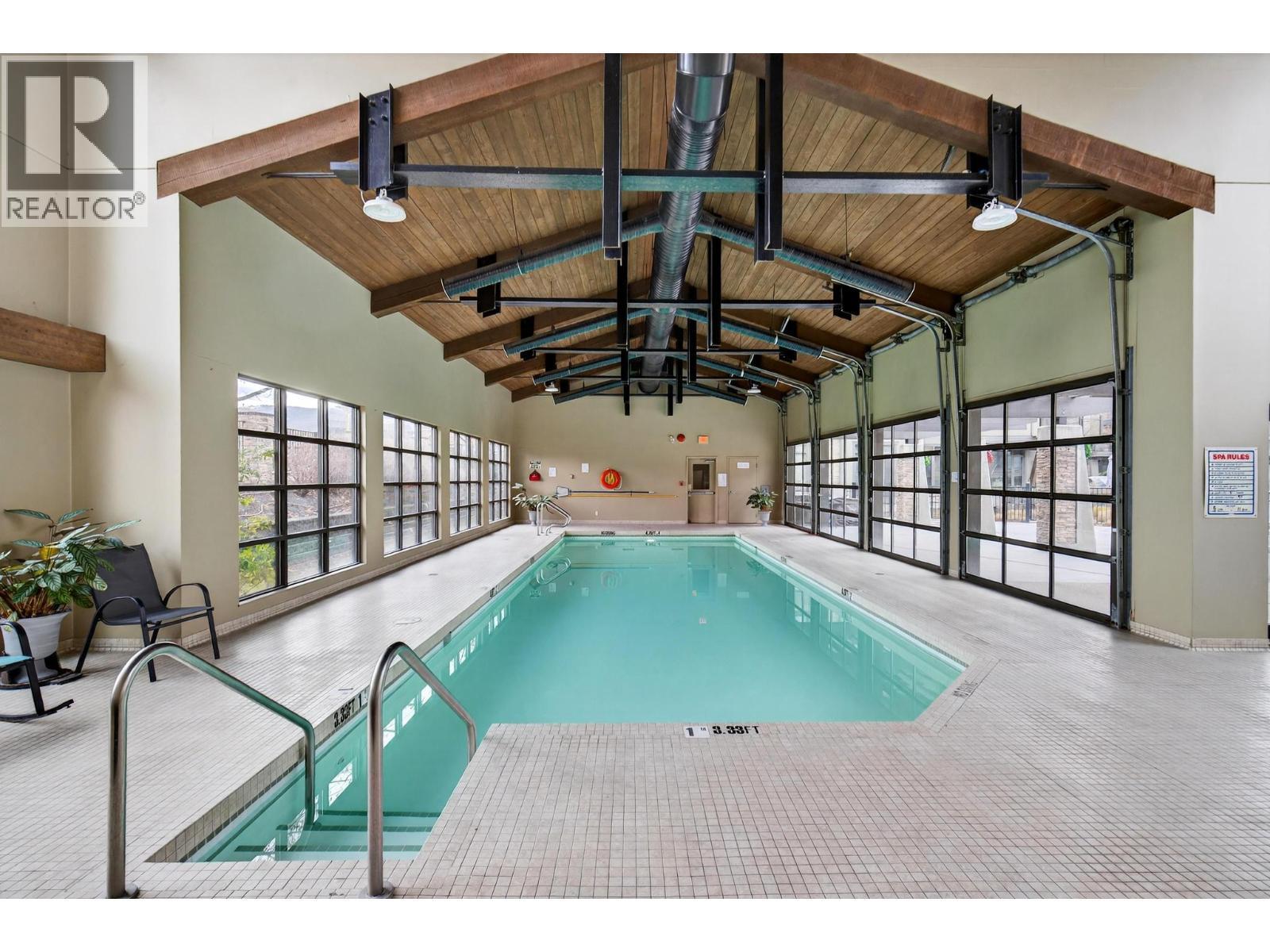 600 Sarsons Road Unit# 203, Kelowna, BC - Indoor Photo Showing Other Room With In Ground Pool