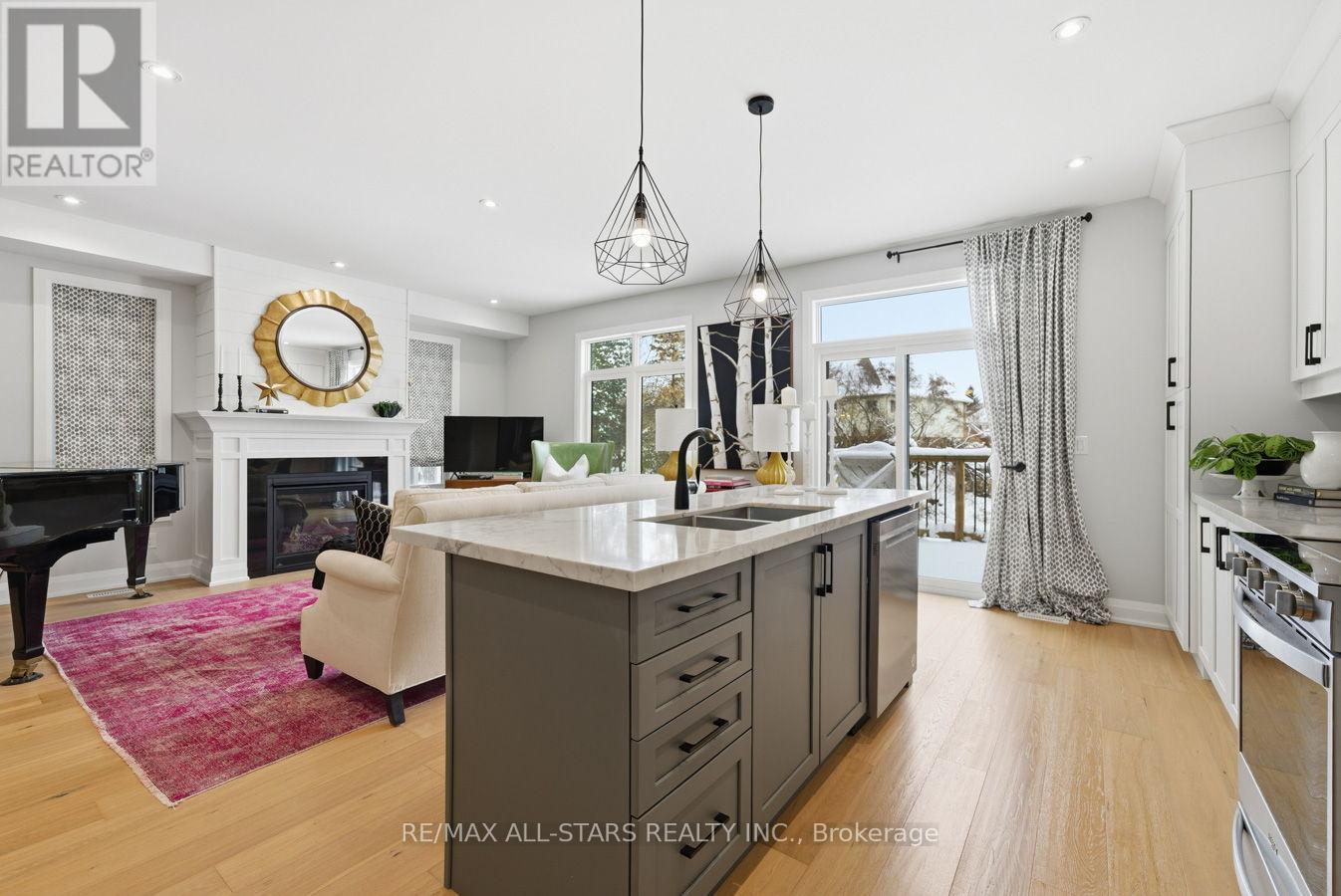 579 Victoria Street, Scugog (Port Perry), ON - Indoor Photo Showing Kitchen With Fireplace With Double Sink
