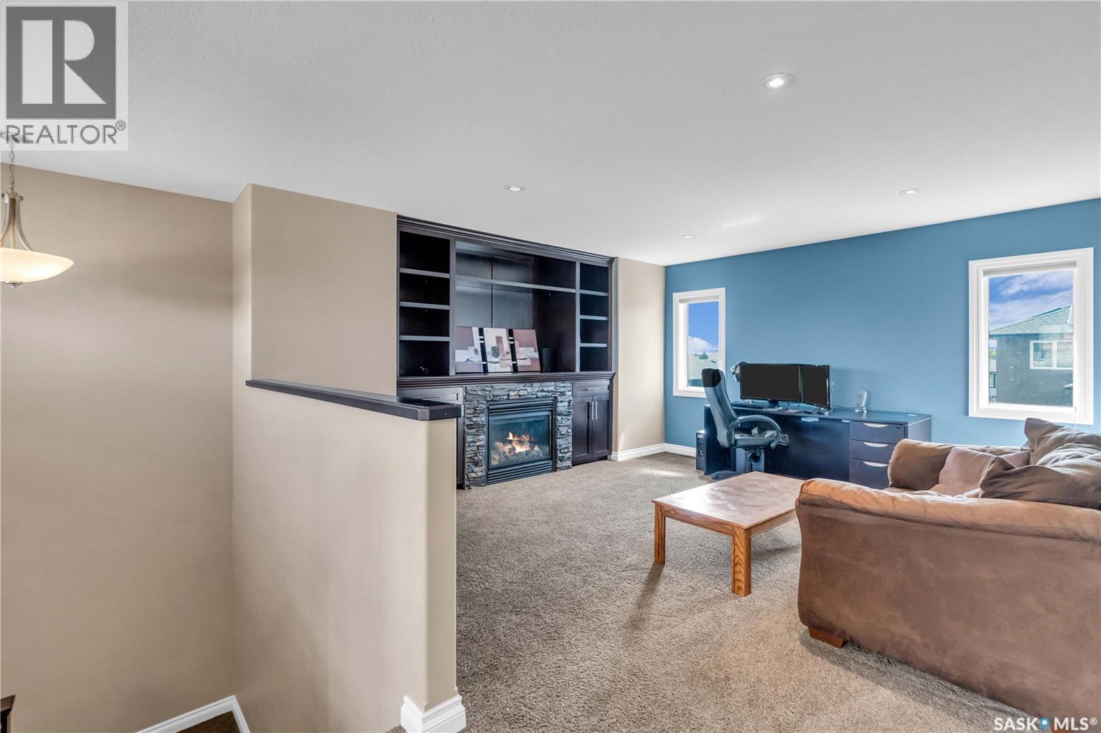 3969 Sandhill Crescent, Regina, SK - Indoor Photo Showing Living Room With Fireplace