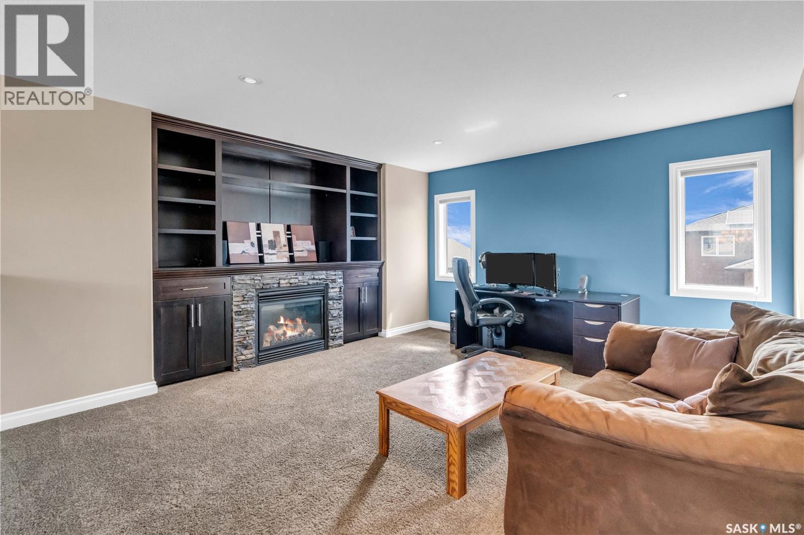 3969 Sandhill Crescent, Regina, SK - Indoor Photo Showing Living Room With Fireplace
