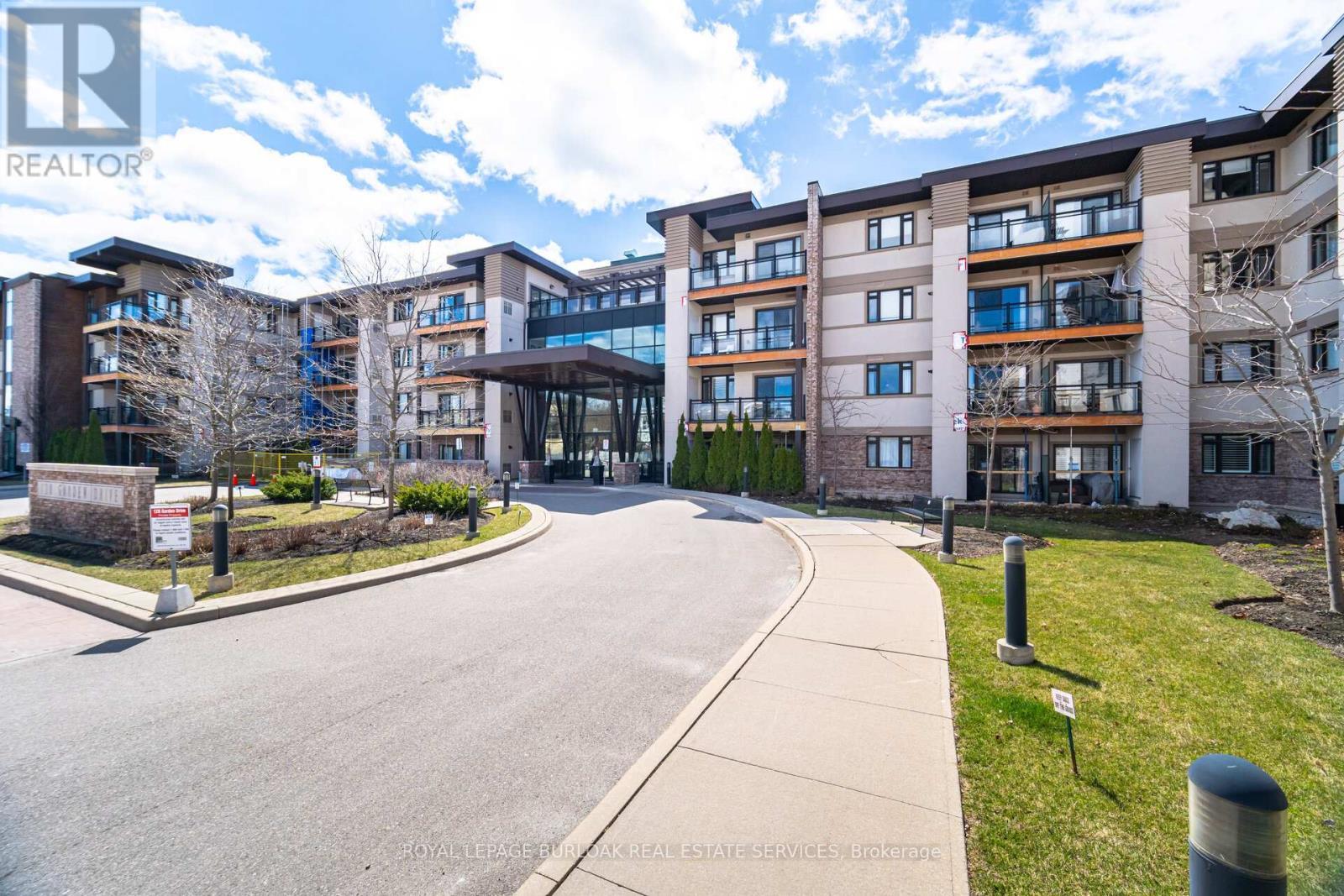 418 - 128 Garden Drive, Oakville, ON - Outdoor With Balcony With Facade