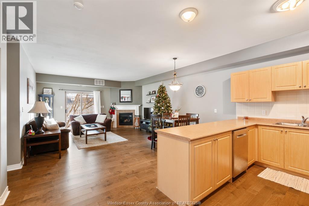 5995 Ellis Street Unit# 202, Lasalle, ON - Indoor Photo Showing Kitchen With Fireplace