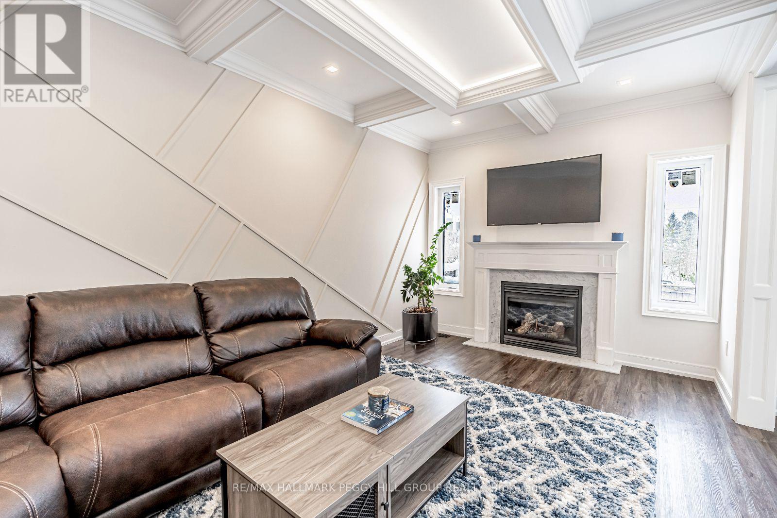99 Mcintyre Drive, Barrie, ON - Indoor Photo Showing Living Room With Fireplace