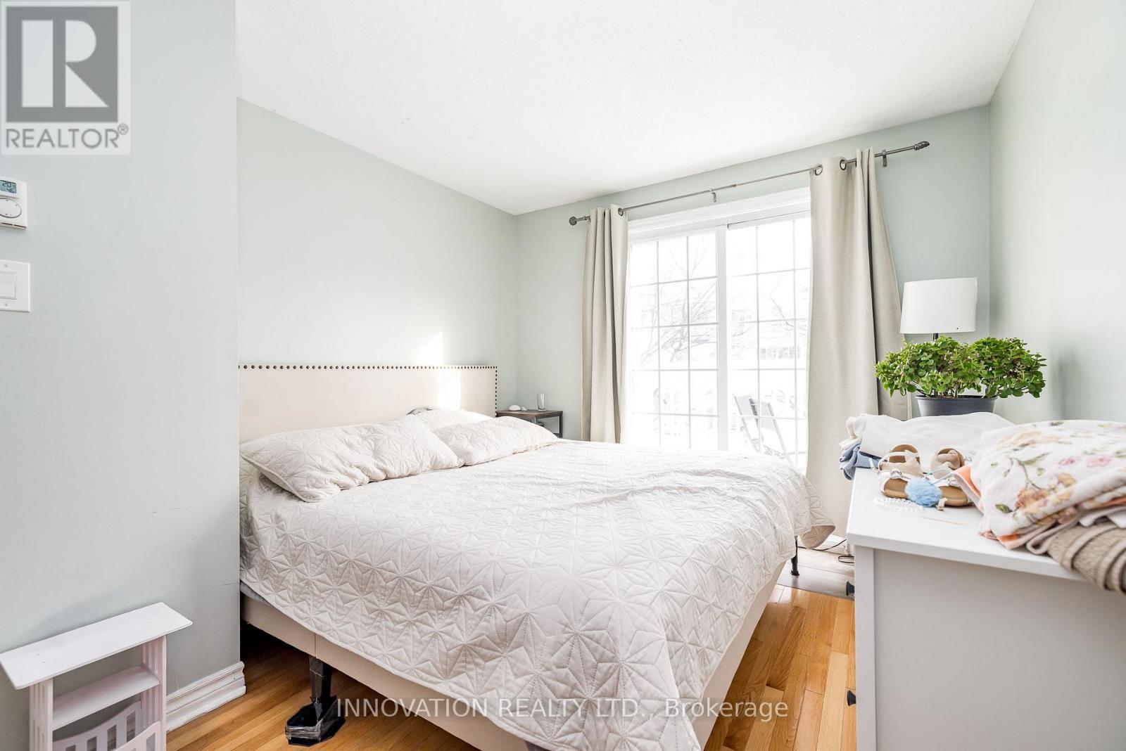 2nd bedroom with sliding door to large balcony! - 58 - 122 Castlegreen Private, Ottawa, ON