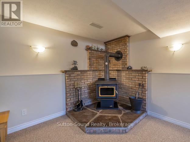 240135 Wilcox Side Road, Georgian Bluffs, ON - Indoor With Fireplace