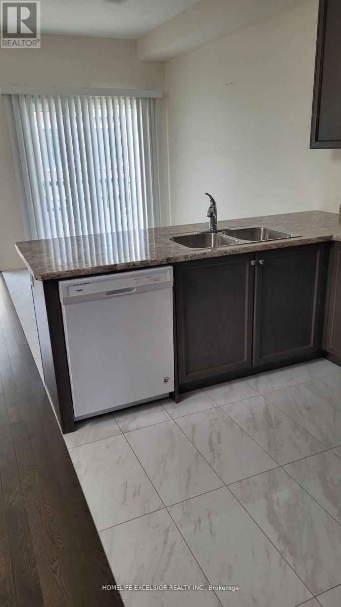 View of breakfast area - 192 Tango Crescent, Newmarket, ON - Indoor Photo Showing Kitchen With Double Sink
