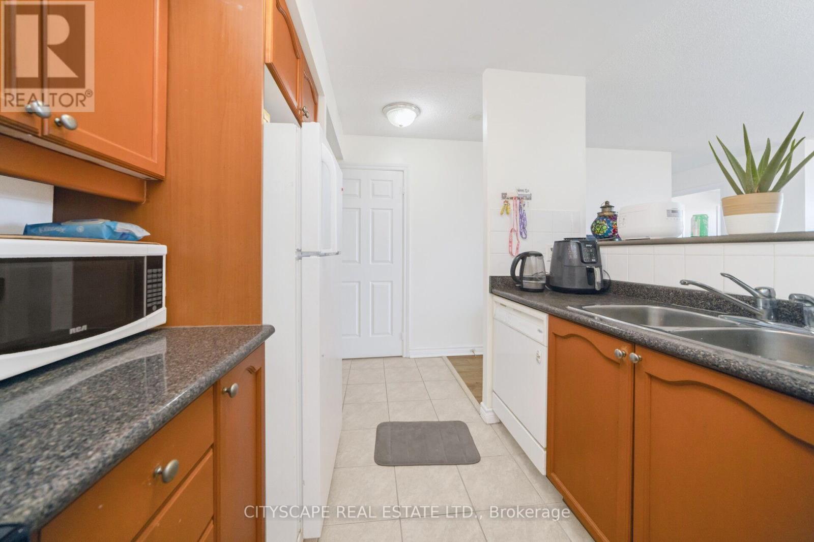 1002 - 710 Humberwood Blvd Boulevard, Toronto, ON - Indoor Photo Showing Kitchen With Double Sink