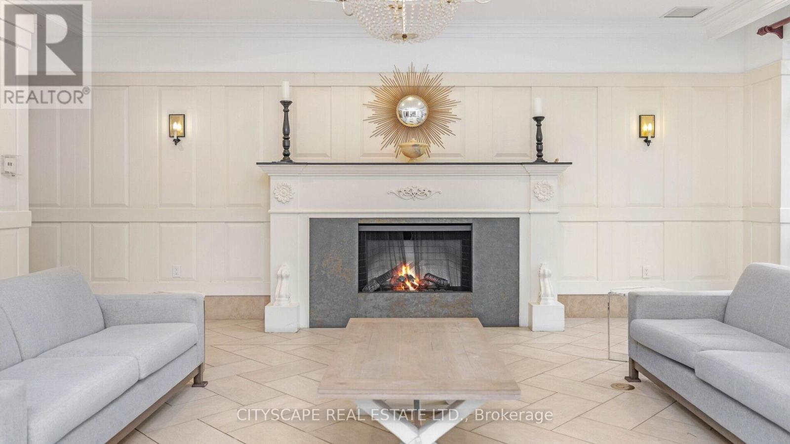 1002 - 710 Humberwood Blvd Boulevard, Toronto, ON - Indoor Photo Showing Living Room With Fireplace