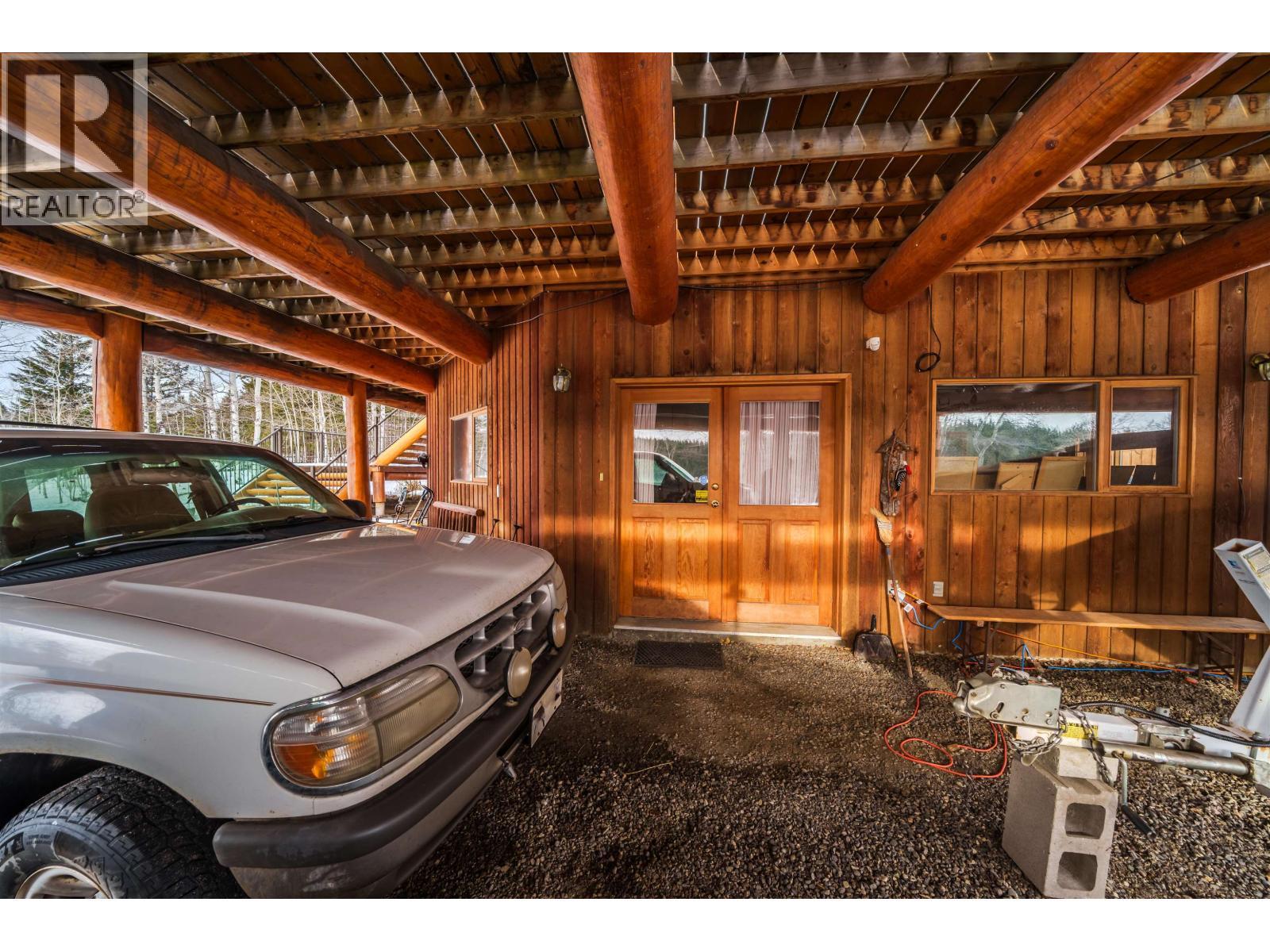 5565 Backvalley Road, 100 Mile House, BC - Indoor Photo Showing Garage
