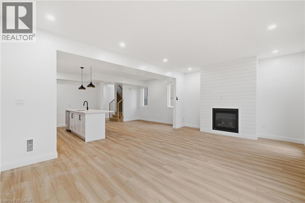 135 Pugh Street, Milverton, ON - Indoor Photo Showing Other Room With Fireplace