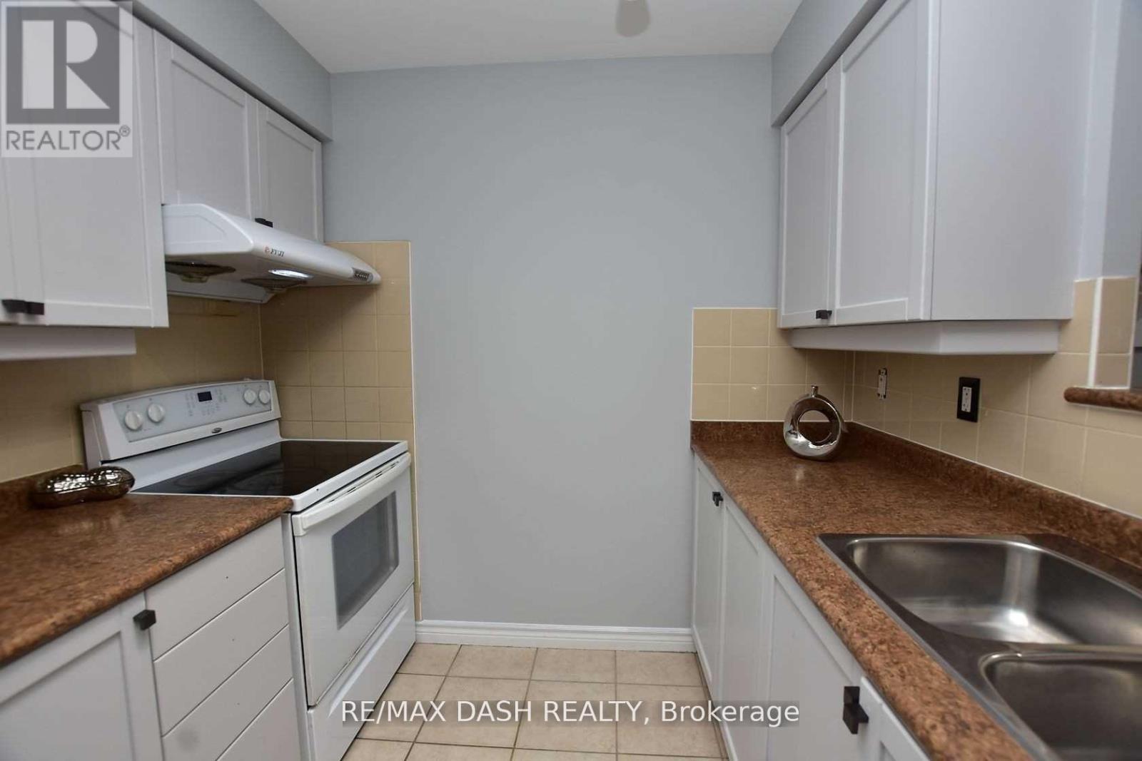 2728 - 700 Humberwood Boulevard, Toronto, ON - Indoor Photo Showing Kitchen With Double Sink
