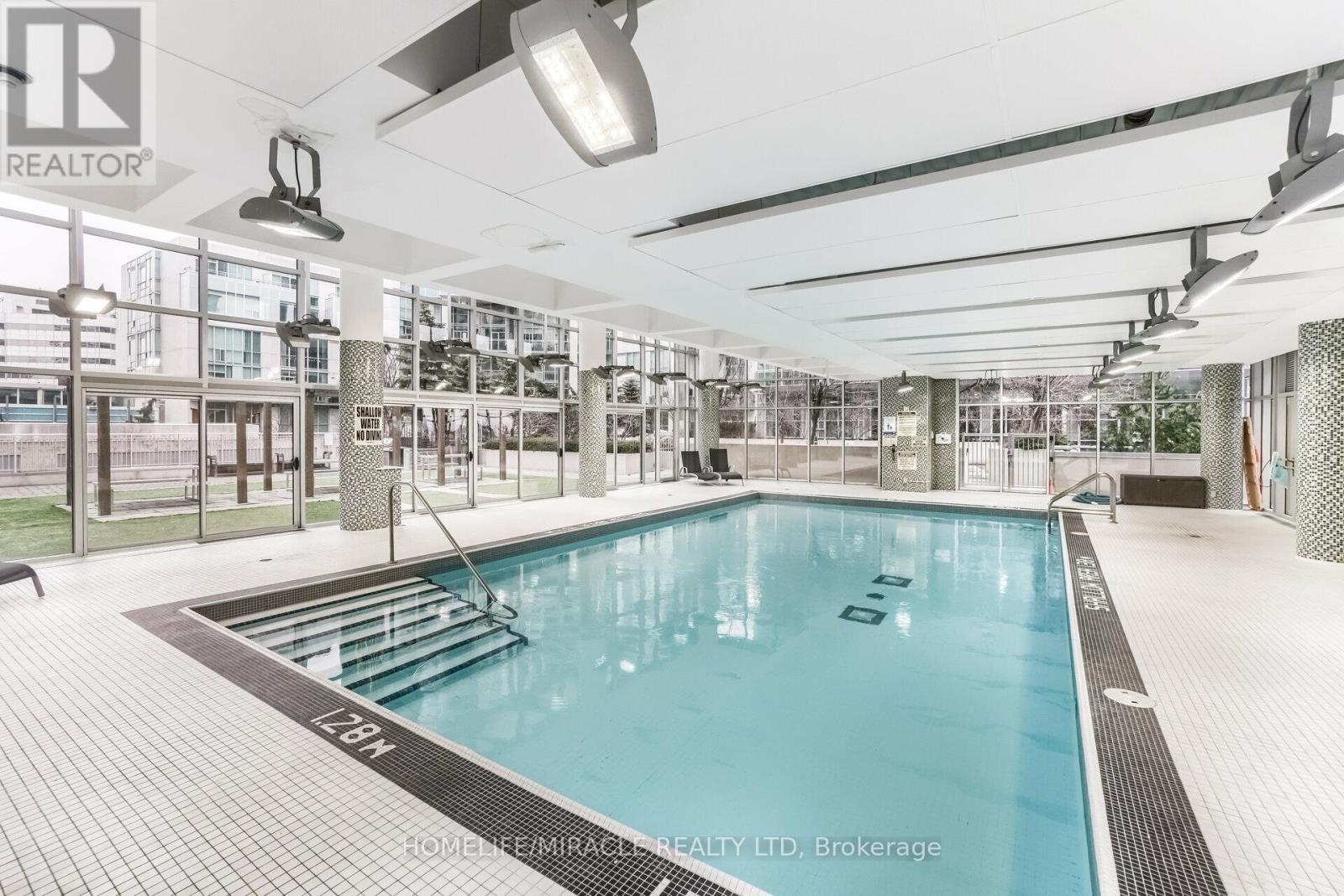 Ph2 - 225 Webb Drive, Mississauga, ON - Photo Showing Other Room With In Ground Pool