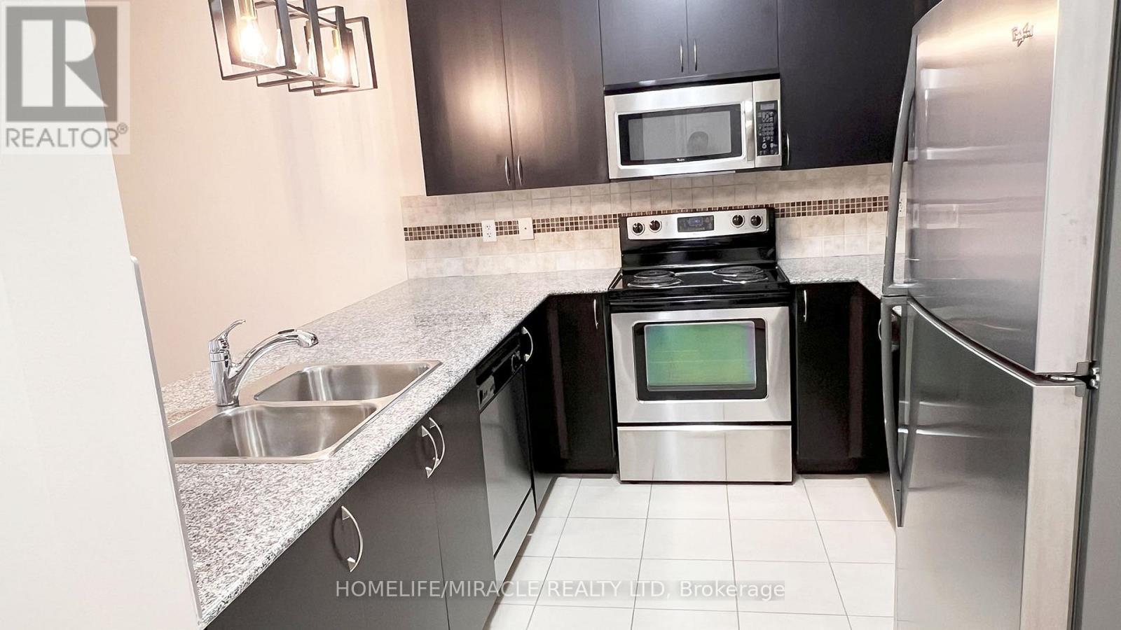 502 - 383 Main Street E, Milton, ON - Indoor Photo Showing Kitchen With Stainless Steel Kitchen With Double Sink With Upgraded Kitchen
