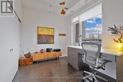 Bedroom with a full wall of closets space -