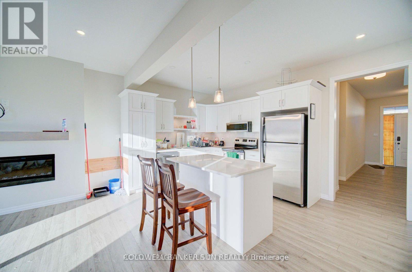 80 Keba Crescent, Tillsonburg, ON - Indoor Photo Showing Kitchen With Fireplace