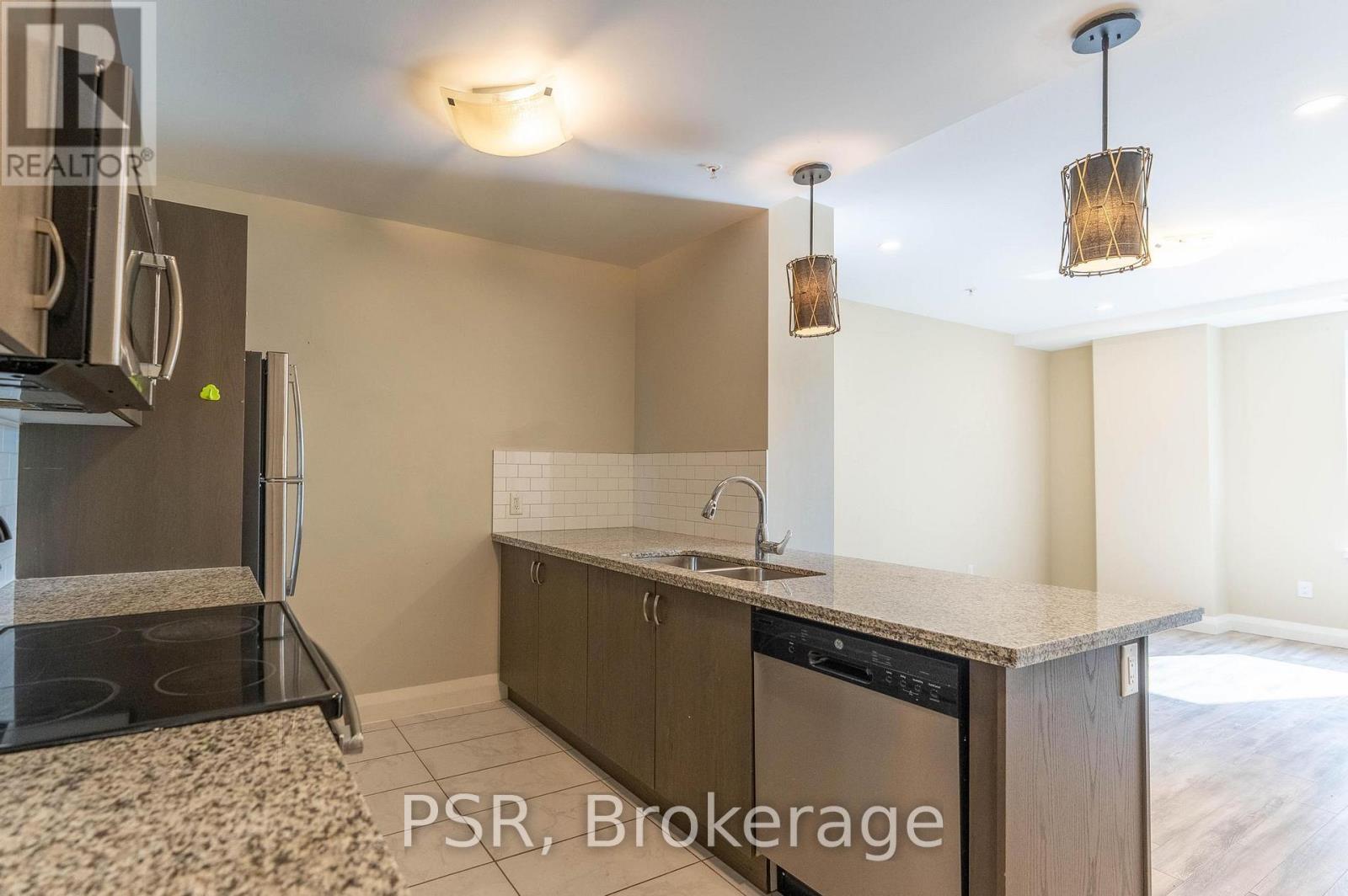 421 - 118 King Street E, Hamilton, ON - Indoor Photo Showing Kitchen With Double Sink