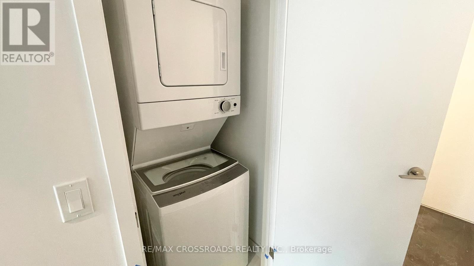 2716 - 230 Simcoe Street, Toronto, ON - Indoor Photo Showing Laundry Room