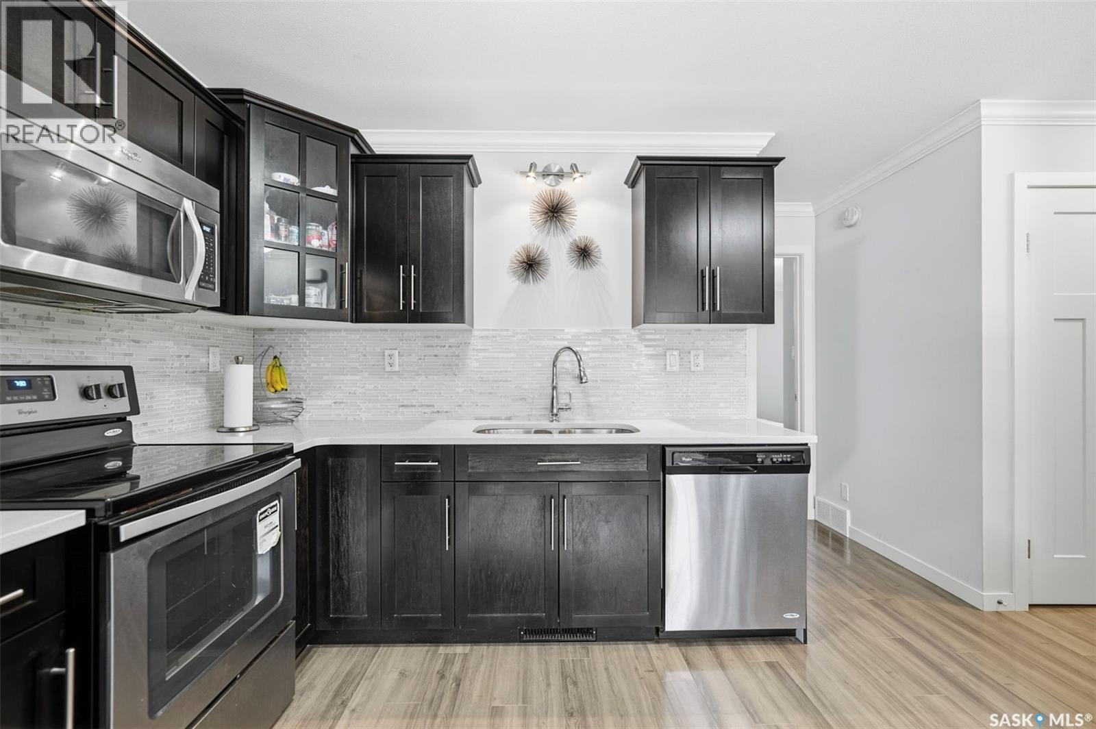 329 320 Cornish Road, Saskatoon, SK - Indoor Photo Showing Kitchen With Stainless Steel Kitchen With Double Sink With Upgraded Kitchen