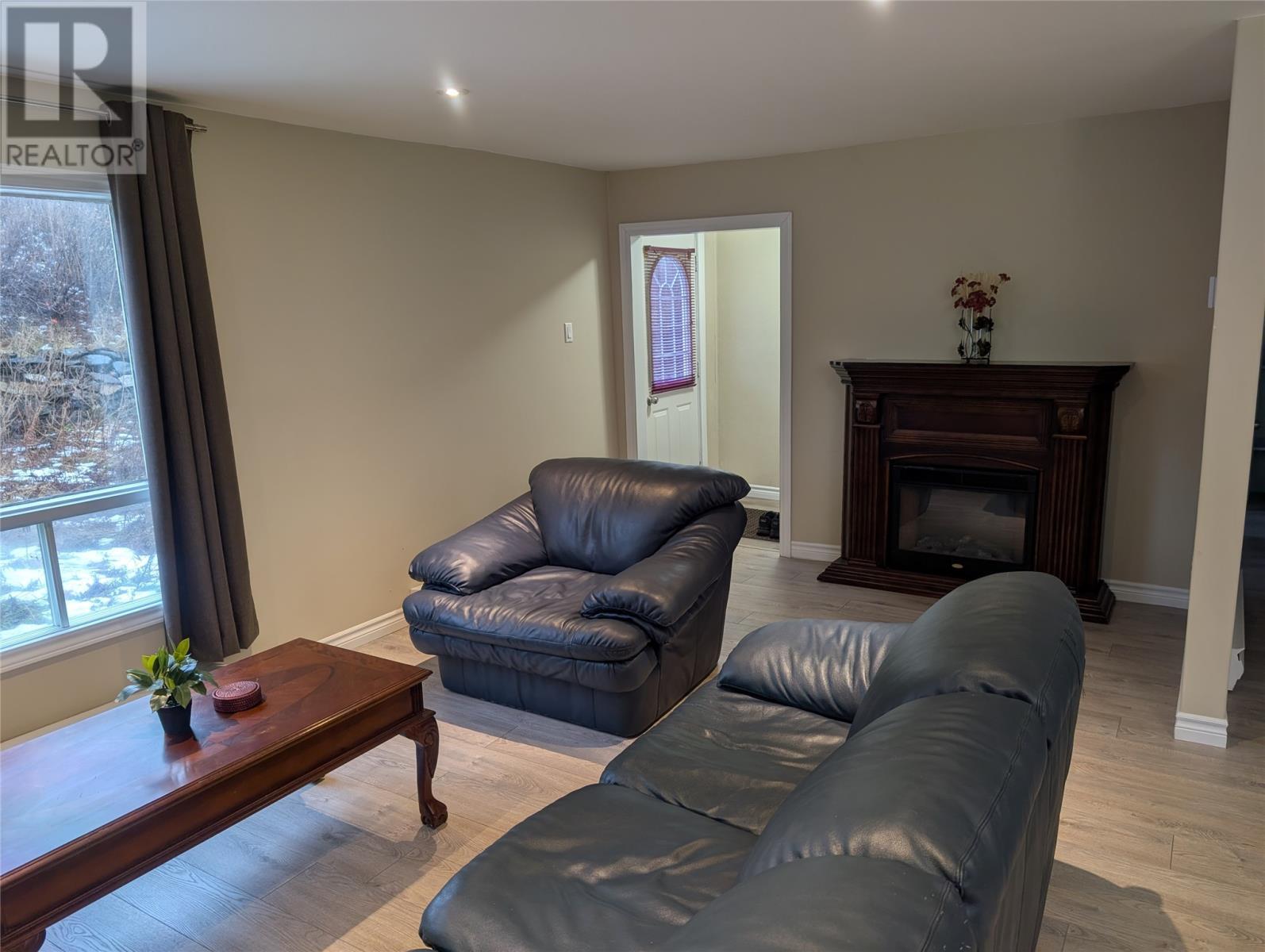 1303 Main Road, Dunville, NL - Indoor Photo Showing Living Room With Fireplace