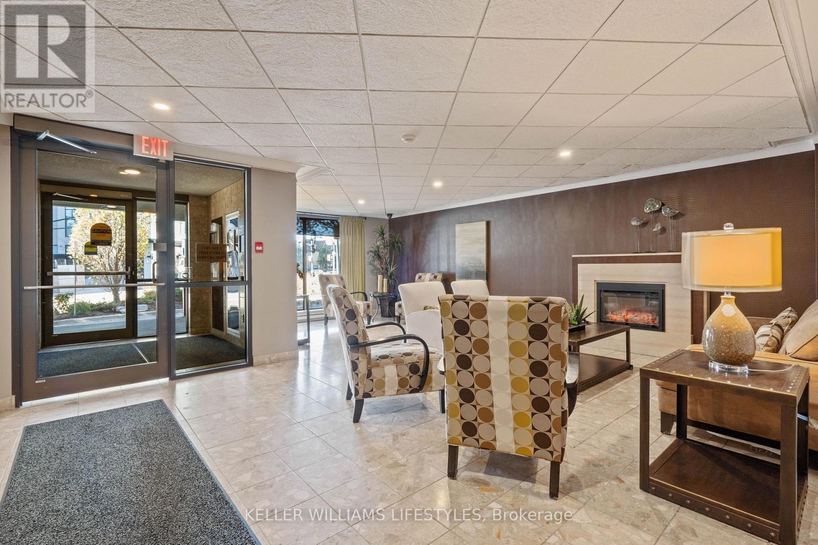1302 - 500 Talbot Street E, London East (East F), ON - Indoor Photo Showing Other Room With Fireplace