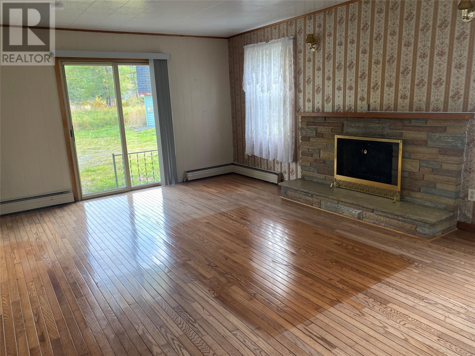 129 Roaches Line Road, Roaches Line, NL - Indoor Photo Showing Other Room With Fireplace