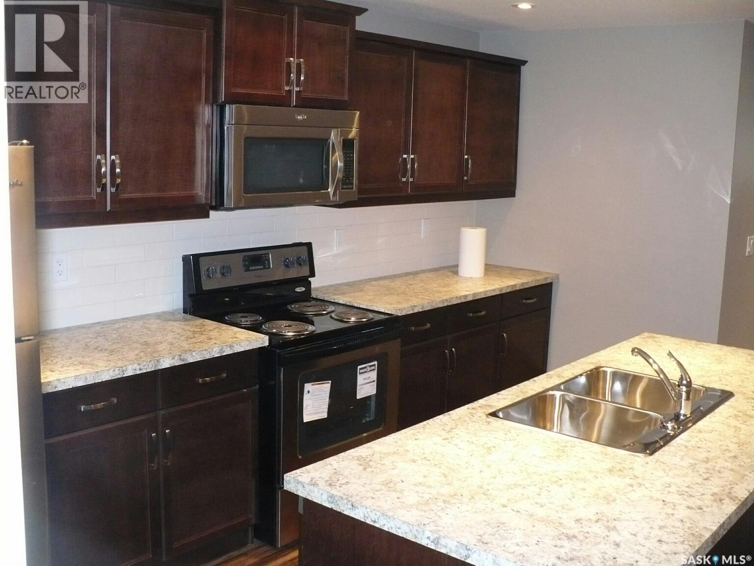 2237 Mcara Street, Regina, SK - Indoor Photo Showing Kitchen With Double Sink