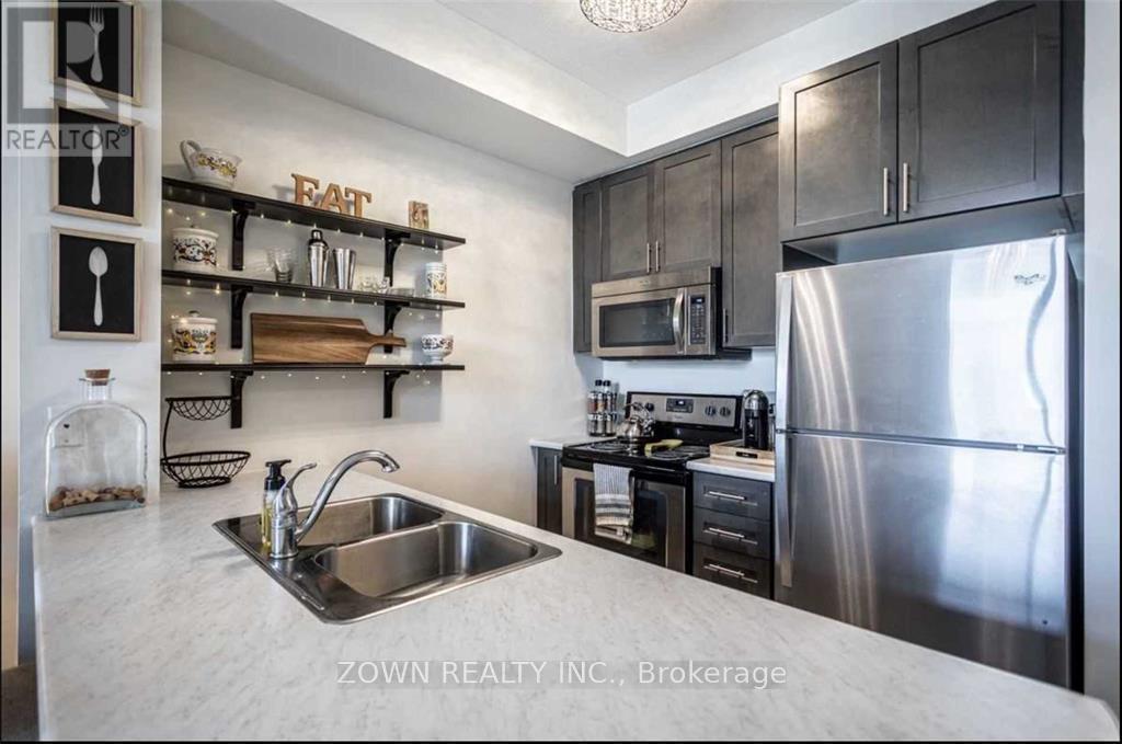 222 - 35 Southshore Crescent, Hamilton, ON - Indoor Photo Showing Kitchen With Stainless Steel Kitchen With Double Sink