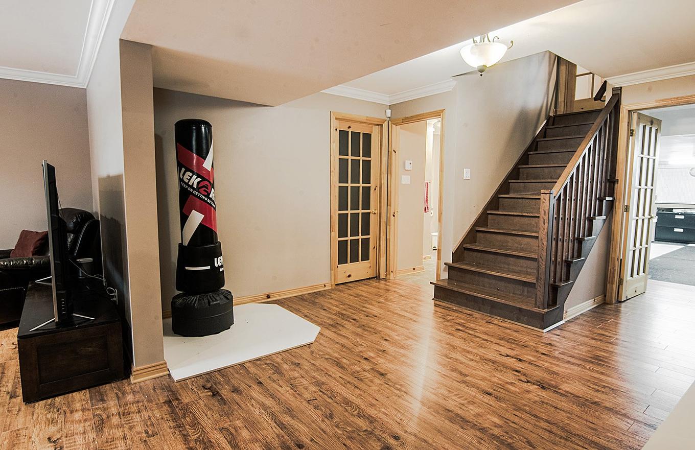 Family room - 165 Rue Des Érables, Carignan, QC - Indoor Photo Showing Other Room