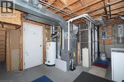 Unfinished below grade area with water heater, electric panel, washer / dryer, and heating unit -