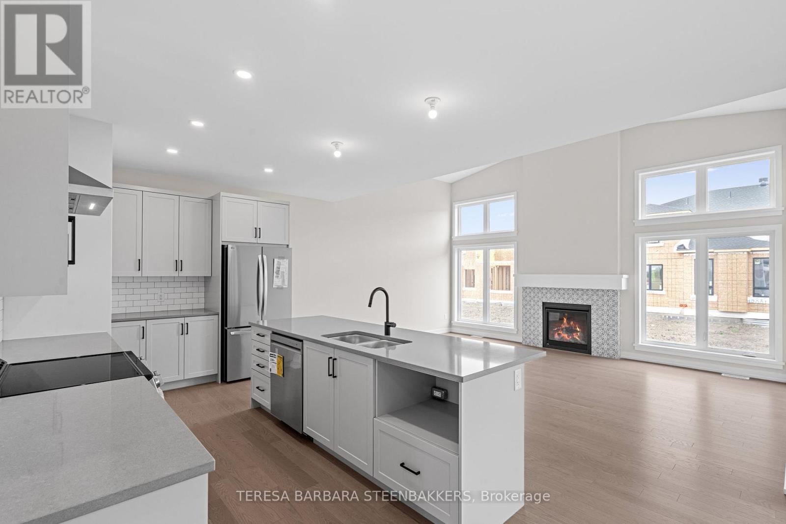 747 Kenny Gordon Avenue W, Ottawa, ON - Indoor Photo Showing Kitchen With Fireplace With Double Sink With Upgraded Kitchen
