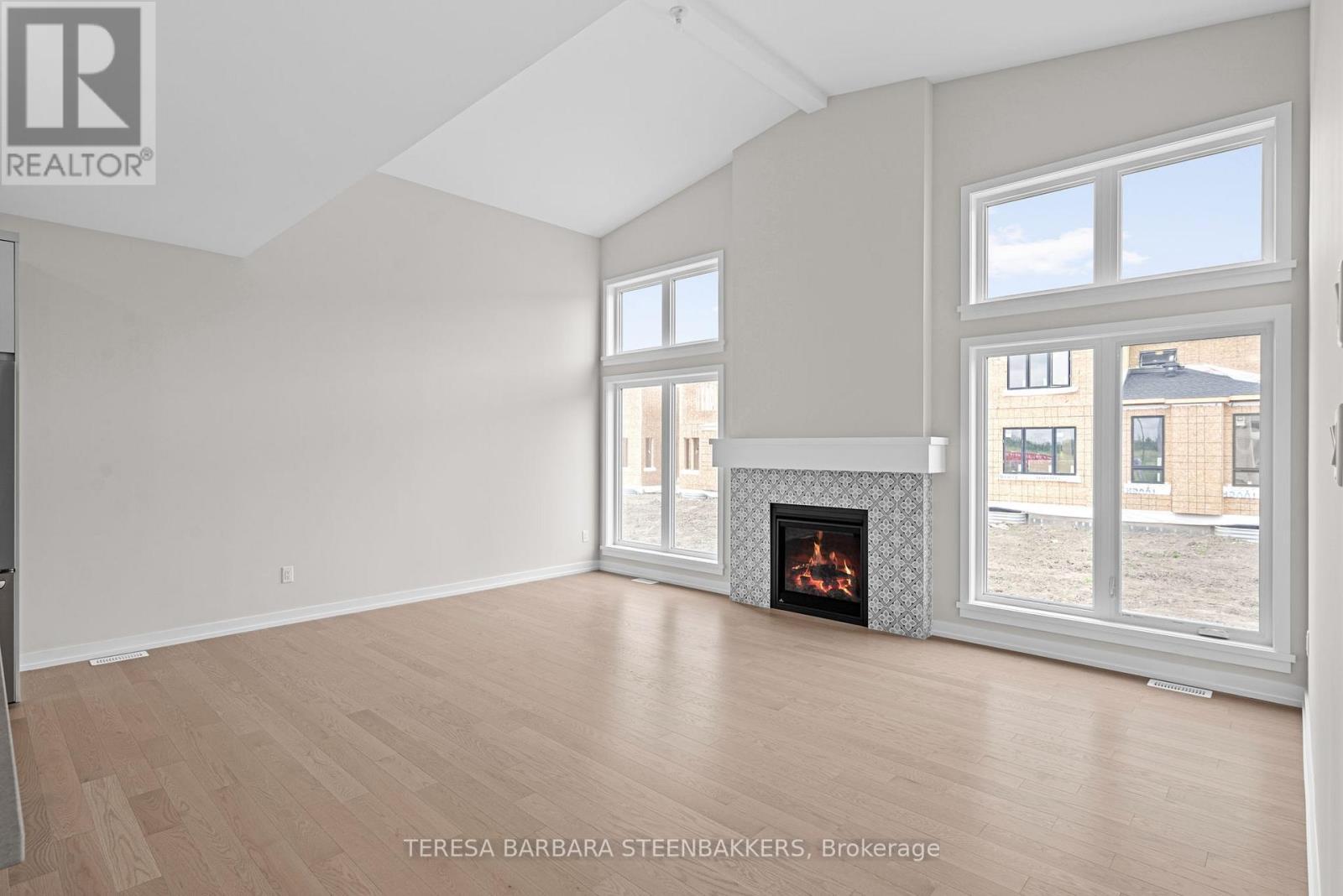 747 Kenny Gordon Avenue W, Ottawa, ON - Indoor Photo Showing Living Room With Fireplace