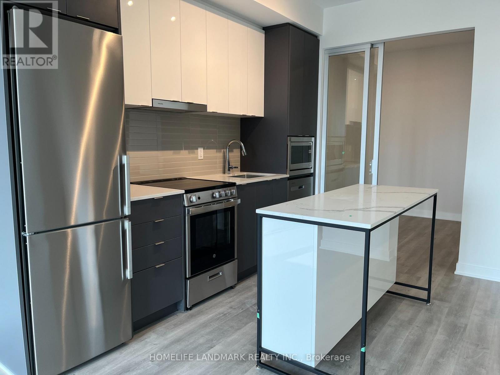 A1003 - 30 Upper Mall Way, Vaughan, ON - Indoor Photo Showing Kitchen With Stainless Steel Kitchen